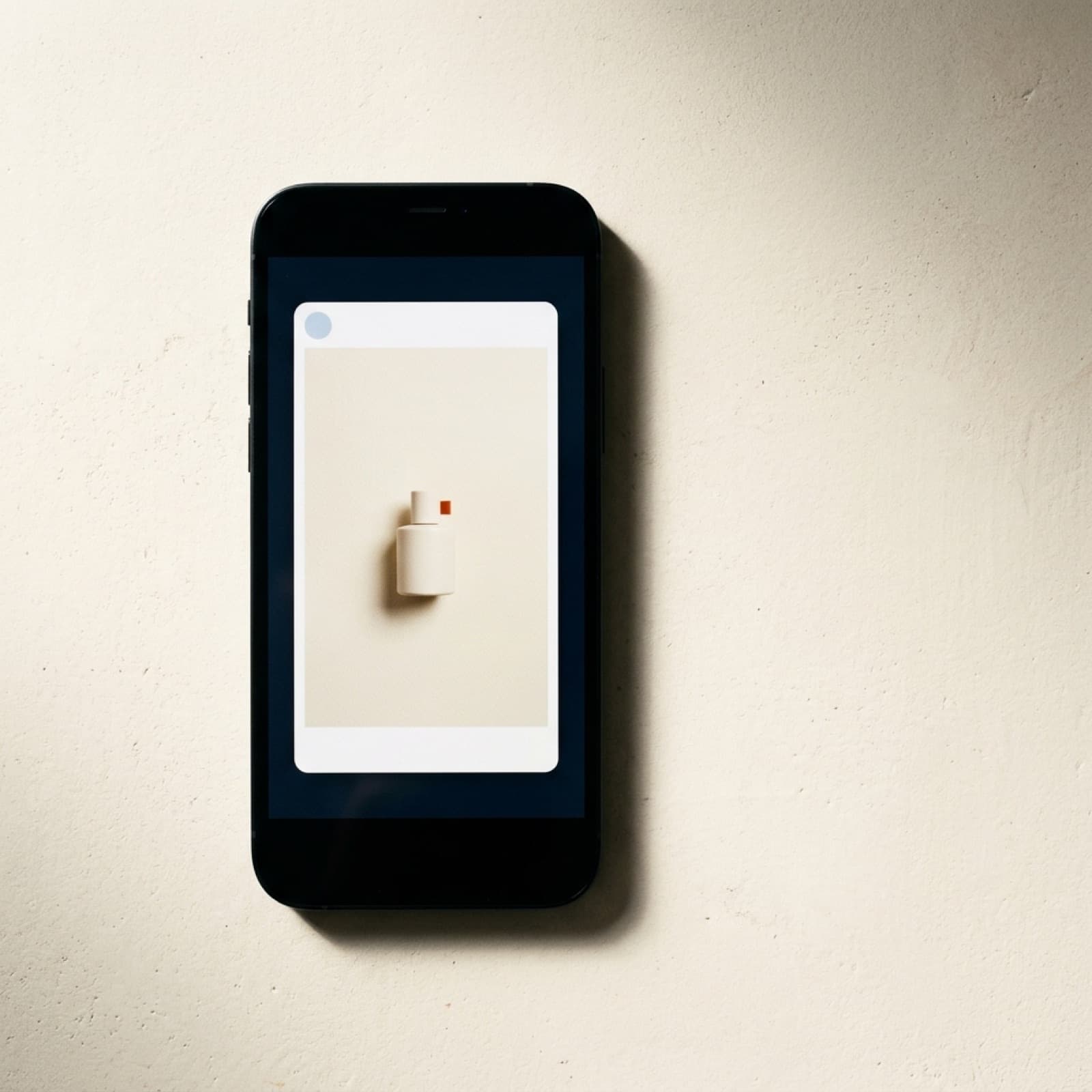 Editorial flat lay of a smartphone displaying a native vertical Meta Reels ad frame on a warm off-white surface.